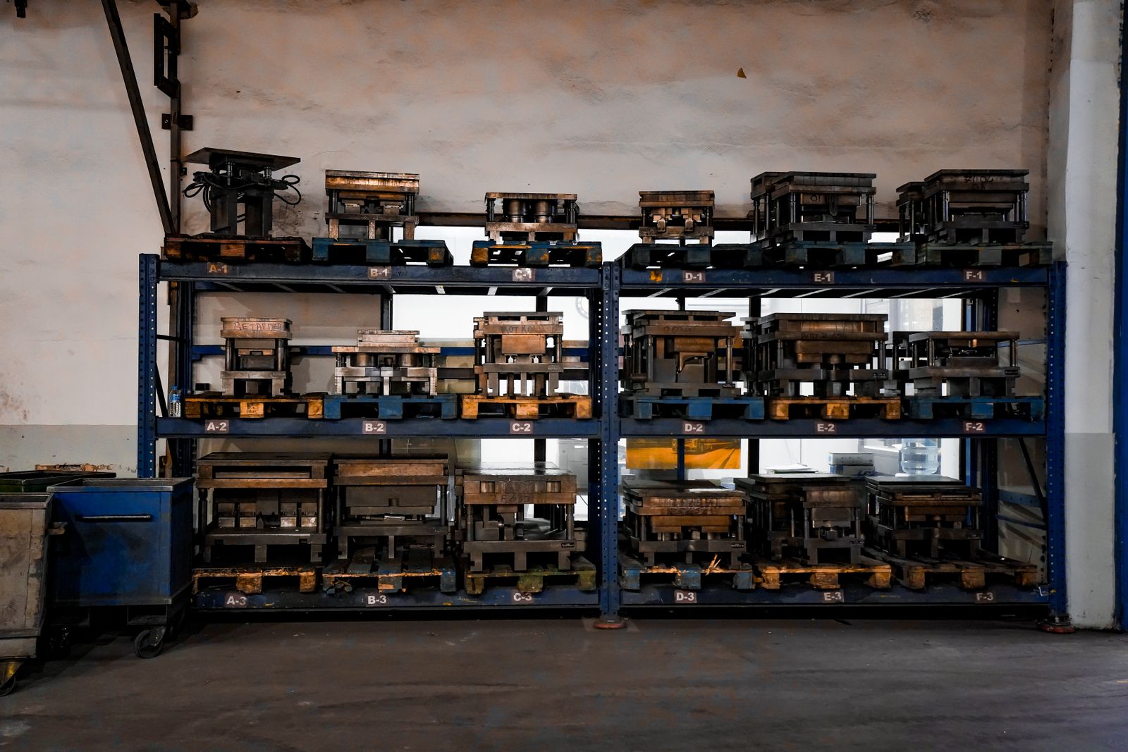 Aluminum soft-tooling molds organized on industrial racking